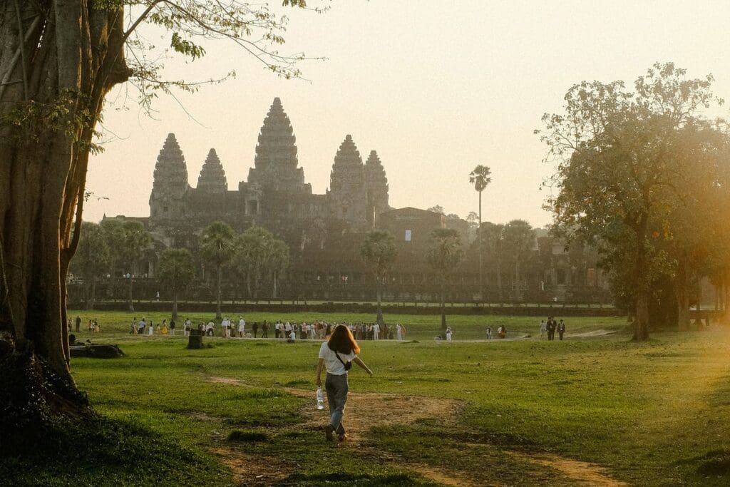 crowd gathered on grounds of Angkor Wat, guide to Visit Angkor Wat by Tailored Travels by Amanda